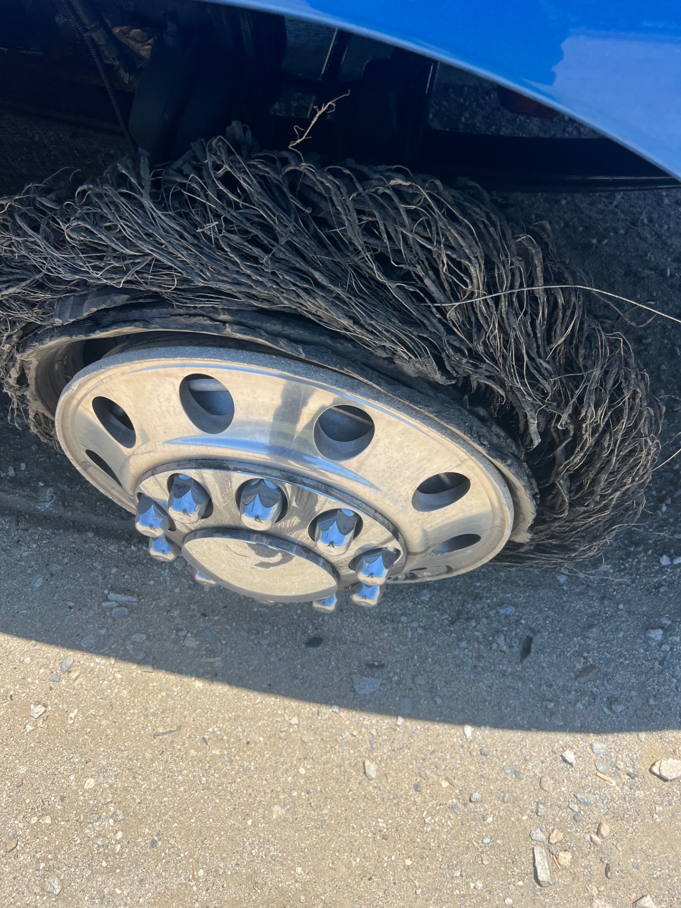 Blown out semi truck tire serviced roadside by F&K Tires LLC